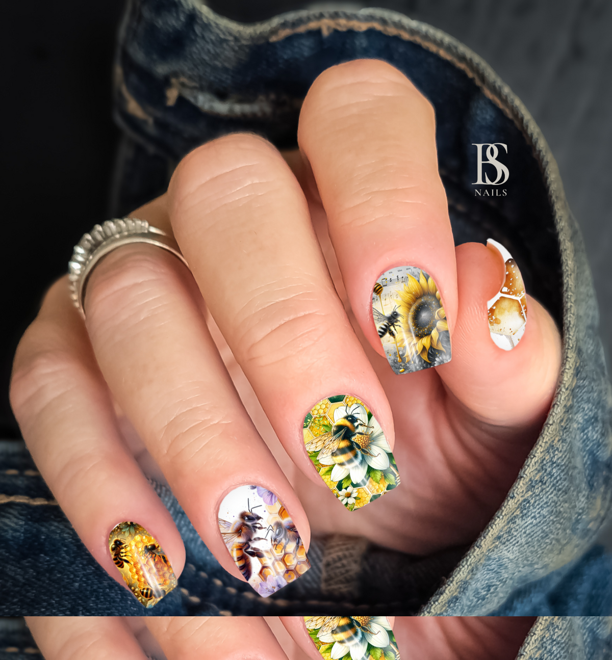 BEE &amp; BOTANICAL WATERSLIDE NAIL DECAL COLLECTION 
image featuring a hand with bee and floral nails decals 